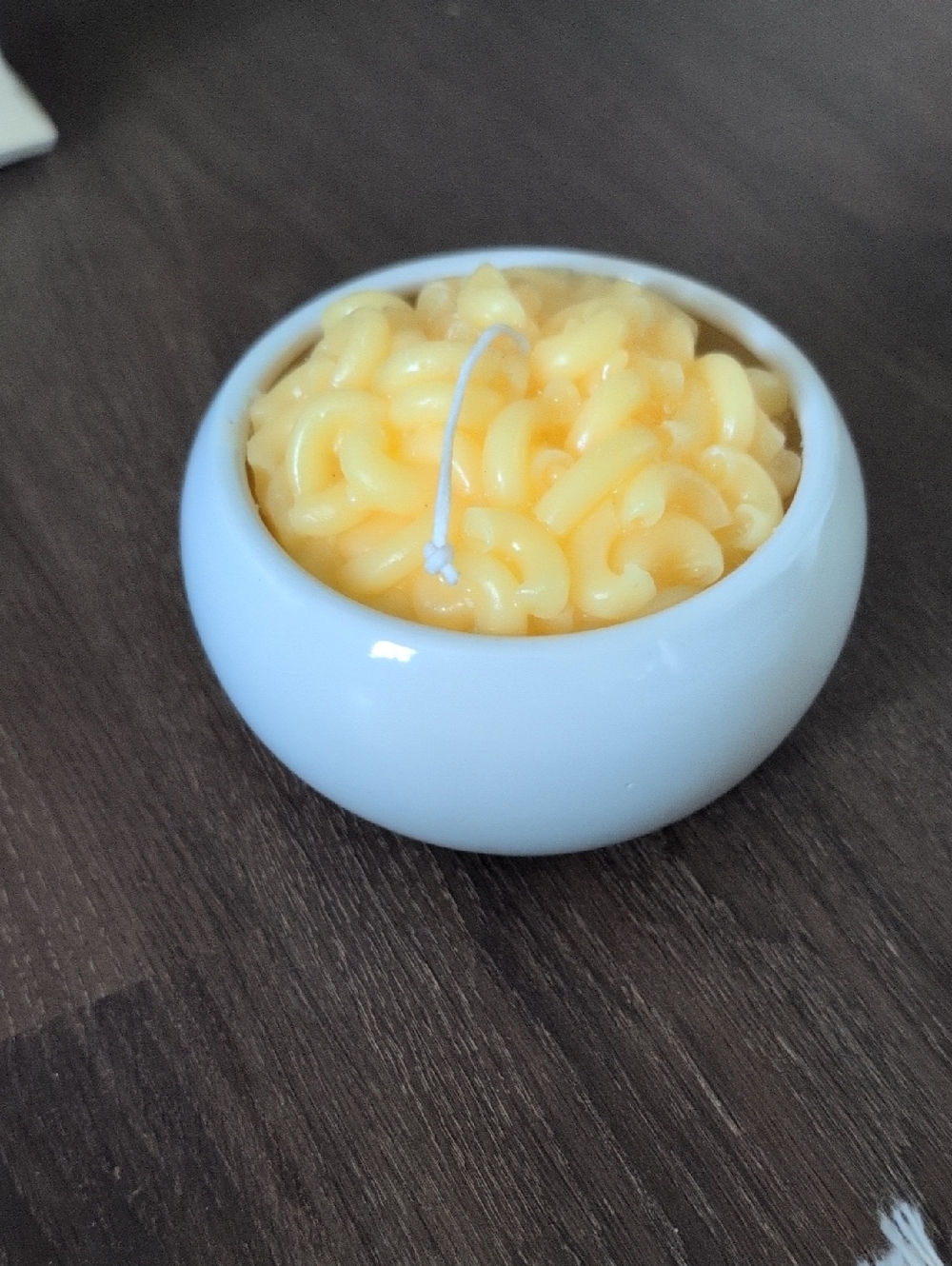 Yellow Macaroni Candle in White Ceramic Bowl